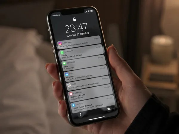 Phone in hand, late-night notifications