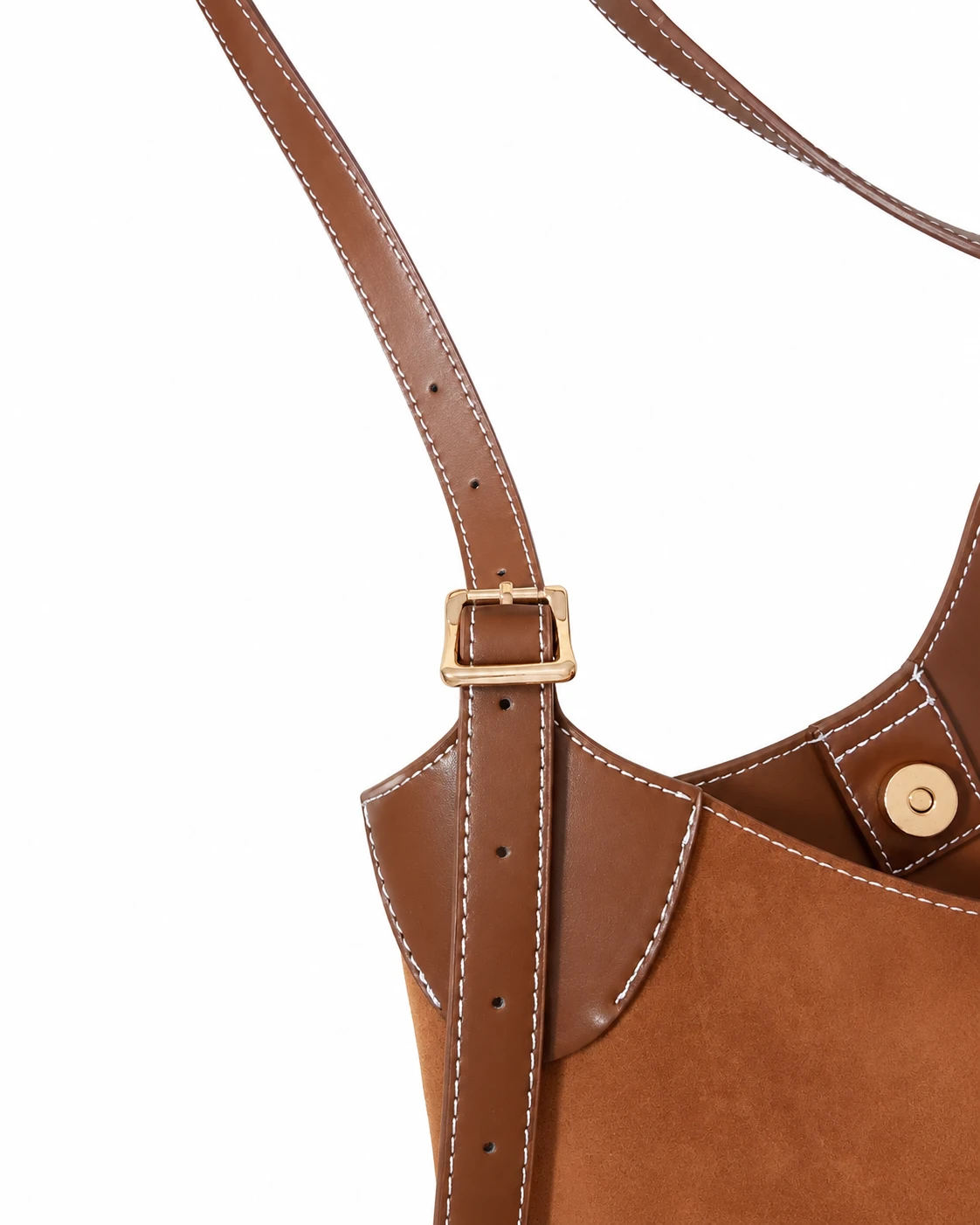 Mira Curve Tote detail - gold buckle on the adjustable strap and magnetic closure with contrast stitching